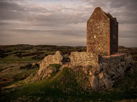 Photo of Smailholm Tower, a ruined tower house in the Scottish Borders, southern Scotland.