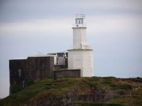 Photo of Mumbles Lighthouse, a lighthouse in Gower, Swansea, south west Wales.