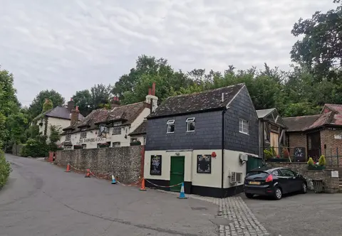 Photo of The Shepherd & Dog, a pub near Fulking in the South Downs, West Sussex, south east England.