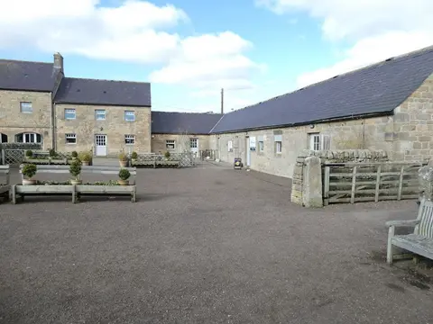 Photo of Kirkharle Courtyard & Lake, a garden in Northumberland, north east England.