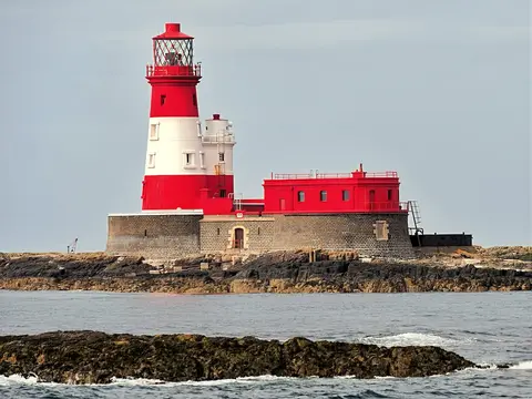 Photo of Longstone Lighthouse, a lighthouse near Seahouses, Northumberland, north east England.