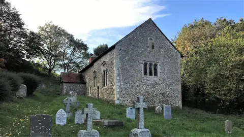 Photo of Coombes Church, a church in the South Downs, West Sussex, south east England.