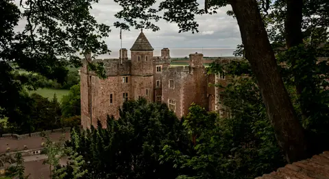 Photo of Dunster Castle, a motte & bailey in Exmoor, Somerset, south west England.