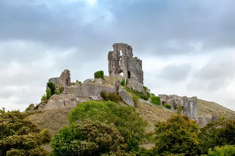 Photo of Corfe Castle, a ruined castle near Kingston, Dorset, south west England.